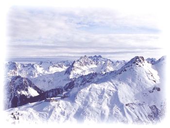 Scenic view of snowcapped mountains against sky
