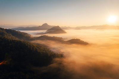 Scenic view of mountains against sky during sunset