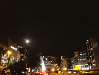 Low angle view of illuminated buildings at night