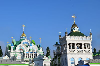 Low angle view of church against clear blue sky