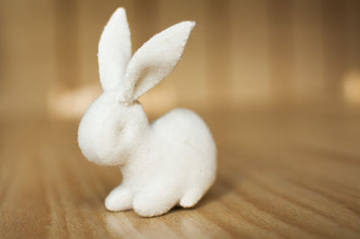 Close-up of white stuffed toy on wooden table