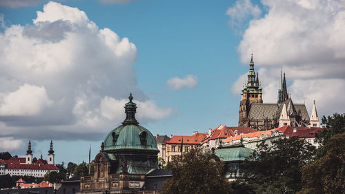 Panoramic view of buildings in city against sky