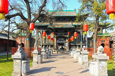 Entrance of temple against building