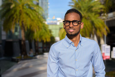 Portrait of young man standing outdoors