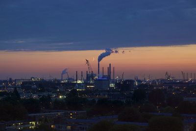 Smoke emerging from chimney against the sky