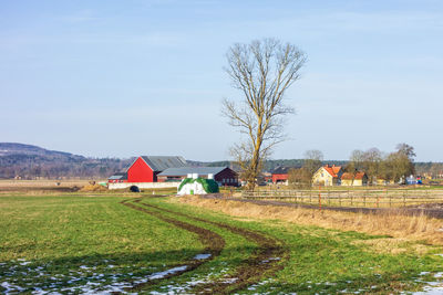 House on field against sky