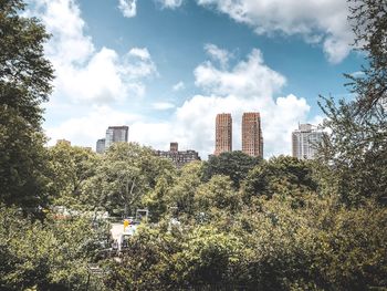 View of buildings against cloudy sky