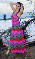 Portrait of beautiful fashion model posing at riverbank