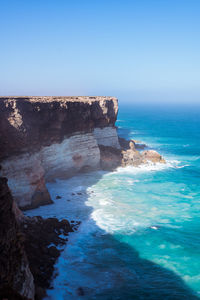 Scenic view of sea against clear blue sky