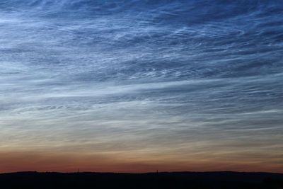 Scenic view of silhouette mountain against sky during sunset