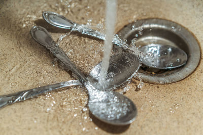 High angle view of water container on table