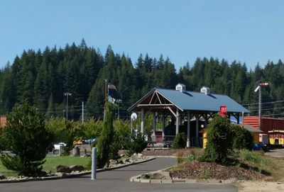 Built structure against trees against clear sky