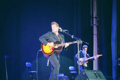 View of guitar at music concert