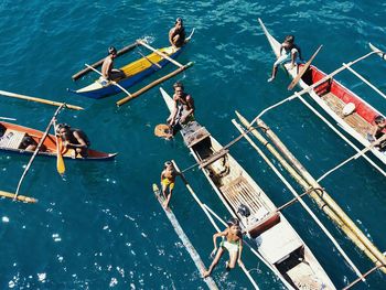 High angle view of people on boat in sea