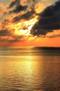 Dramatic sky over sea during sunset