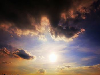 Low angle view of dramatic sky during sunset