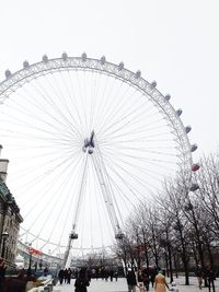 Low angle view of ferris wheel against sky