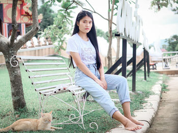 Young woman sitting in park