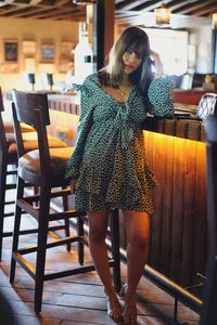 Woman sitting on chair in restaurant