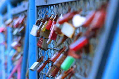 Close-up of padlocks on railing