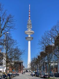 View of communications tower and buildings in city