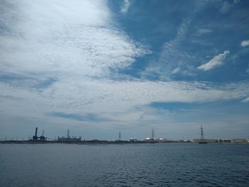 View of city against cloudy sky