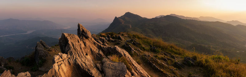 Panoramic view of mountain range against sky during sunset