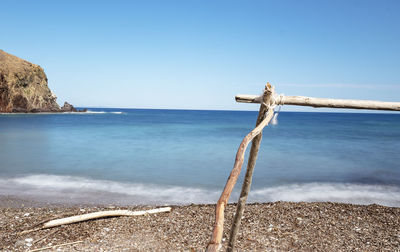 Scenic view of sea against clear blue sky