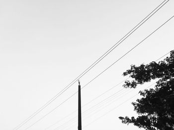 Low angle view of cables against clear sky