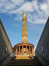 Low angle view of statue against sky