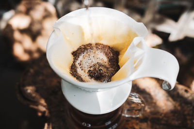 Barista dripping coffee and slow coffee bar style