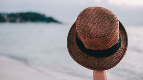 Close-up of hat on beach