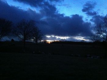 Scenic view of landscape against sky at sunset