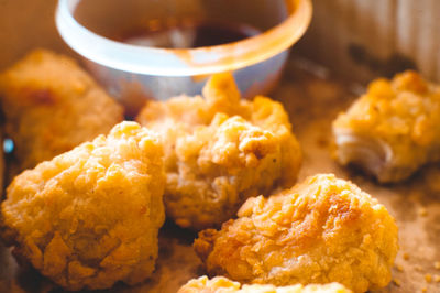 Close-up of chicken nuggets in container