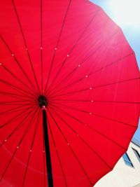 Low angle view of red umbrella