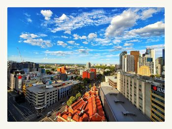 High angle view of buildings in city against sky