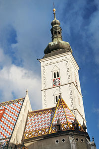 Low angle view of clock tower against sky