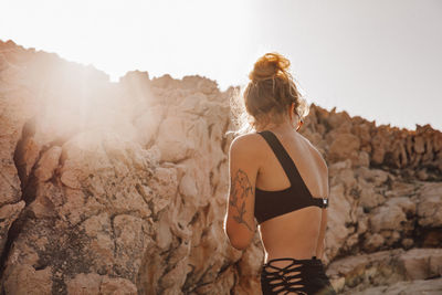 Woman standing against sky during summer