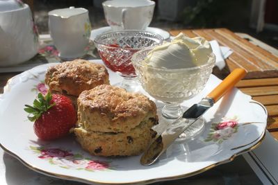 Close-up of cream tea on plate on table