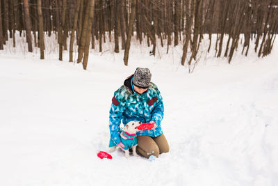 Full length of person on snow covered field