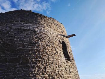 Low angle view of old building against sky