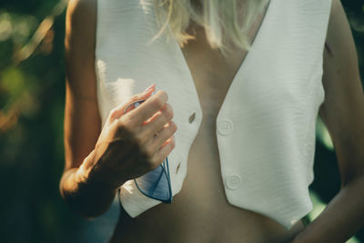 Midsection of woman holding hands