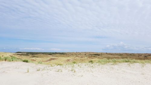 Scenic view of land against sky