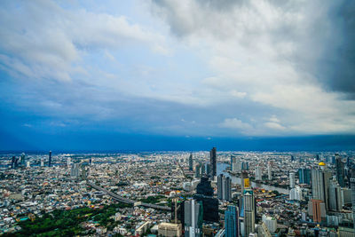 Aerial view of cityscape against sky