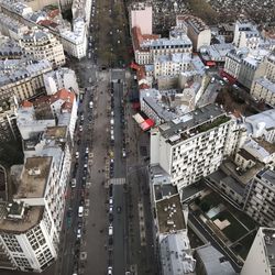 Aerial view of road amidst buildings in city