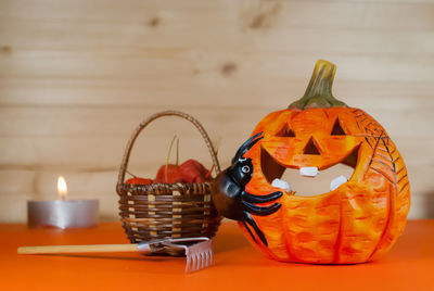 Close-up of pumpkin in basket on table