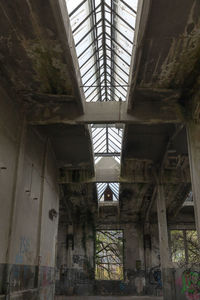 Low angle view of window in abandoned building