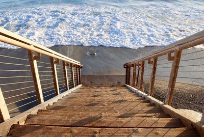 High angle view of steps by sea