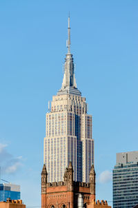 Low angle view of building against clear blue sky