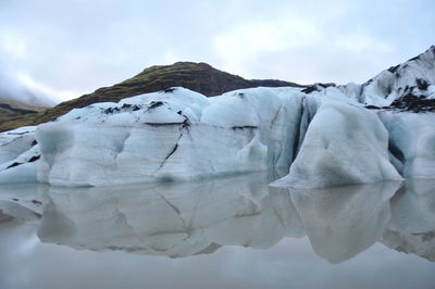 Scenic view of frozen lake against sky